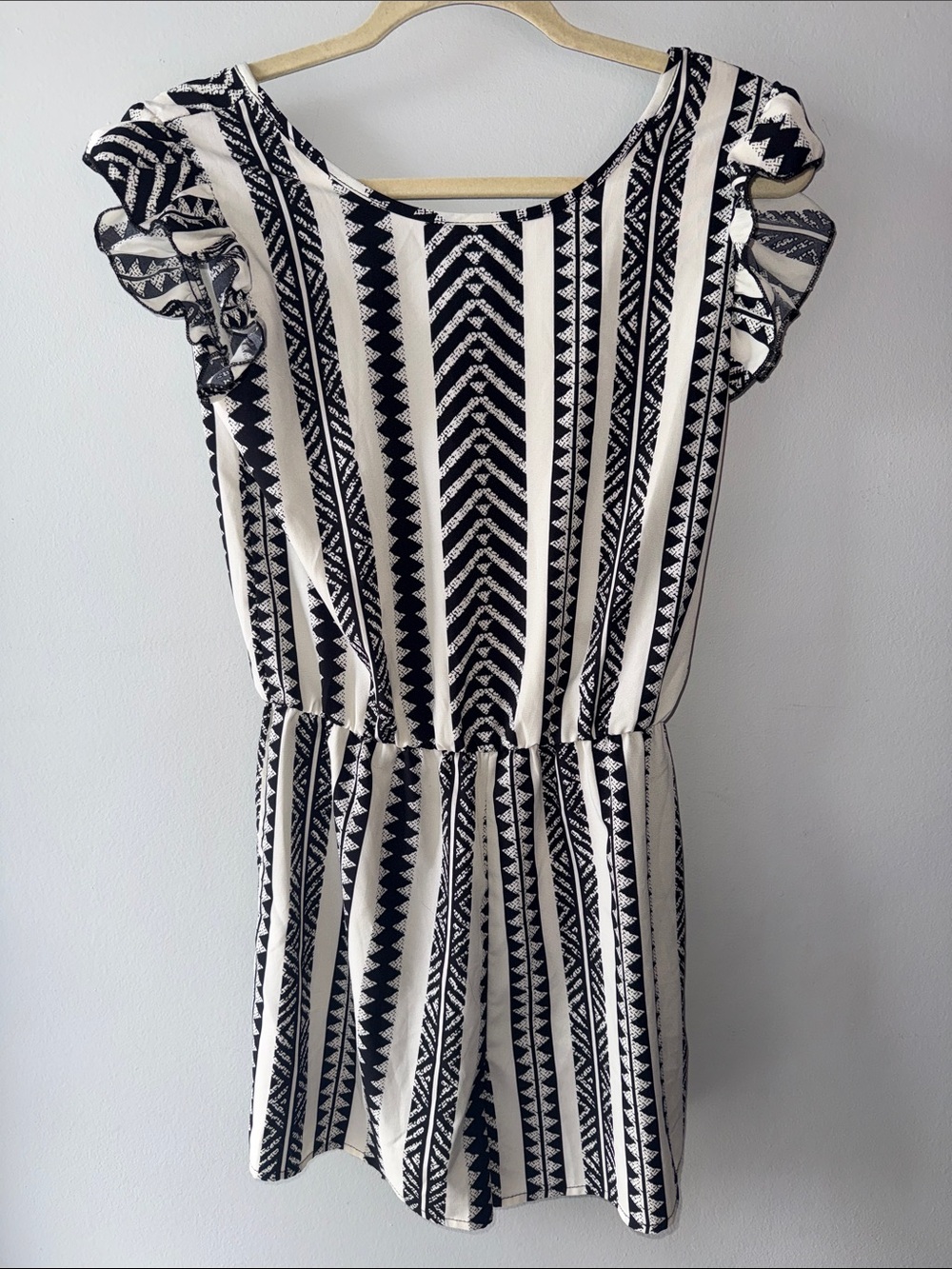 Psychedelic print flutter sleeve romper with a tie-back